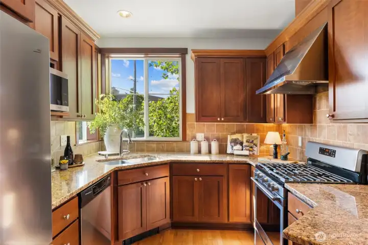 Bright chef’s kitchen with generous prep space and large window outlook.