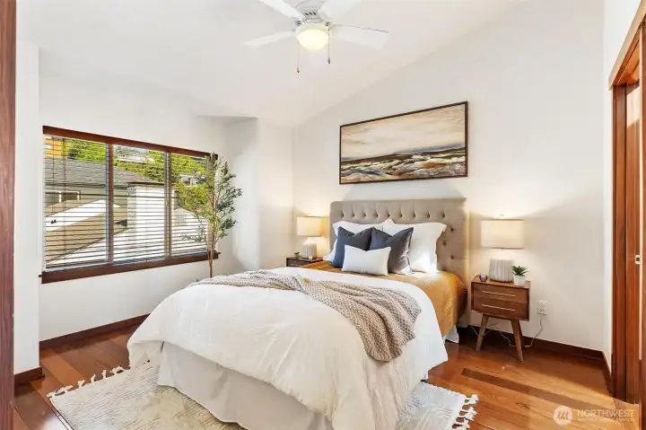 Comfortable bedroom filled with natural light and generous proportions.