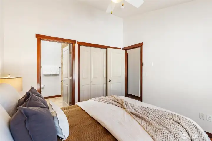Bedroom with ample storage and clean, versatile design.