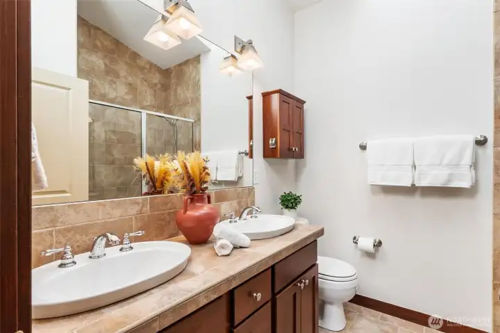 Spacious bathroom featuring dual vanity and ample counter space.