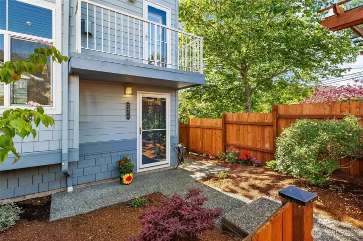 Private side yard with mature plantings and peaceful outdoor enjoyment.