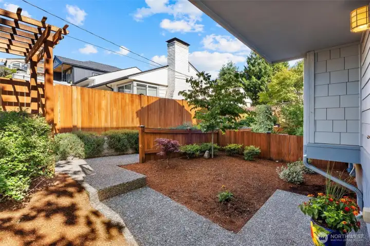 Landscaped yard area designed for easy outdoor living.