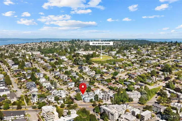 Wide aerial showing proximity to neighborhood amenities and city surroundings.