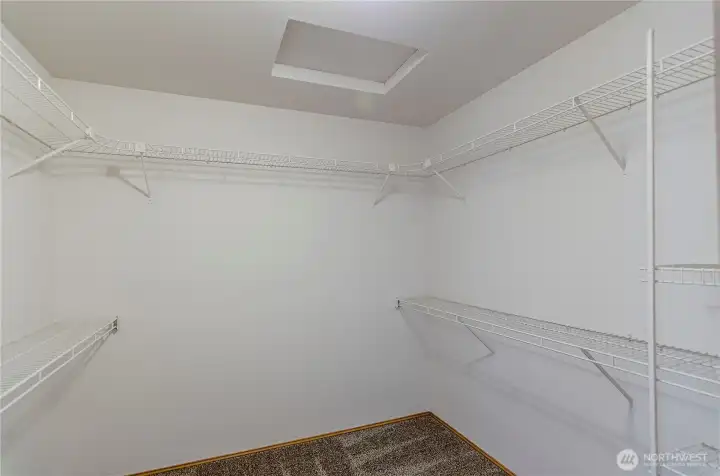 Primary walk-in closet. Primary walk-in closet.