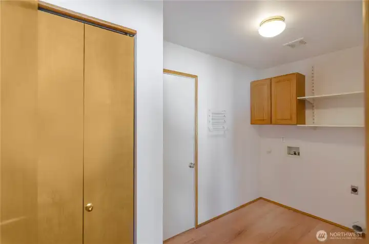 Spacious utility room with storage and additional closet. Spacious utility room with storage and additional closet.