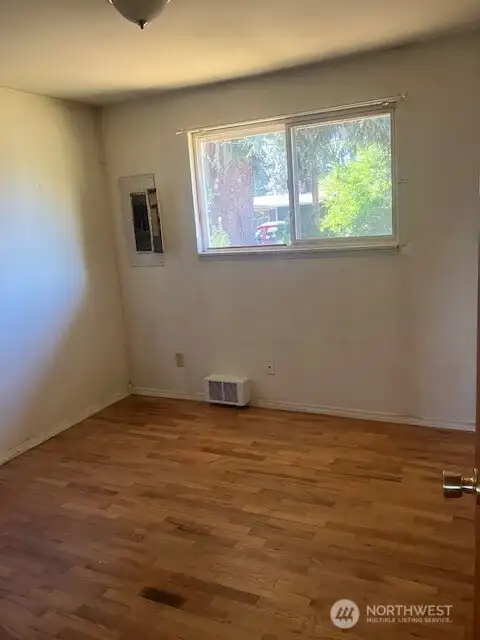 One of 3 Bedrooms with hardwood floors
