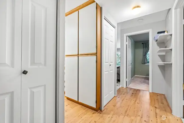Within the Entry Hall, there is a Coat Closet in the foreground and a Stack Washer/Dryer in the second Closet.