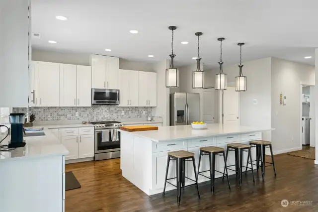 Enormous kitchen island featuring an abundance of storage.