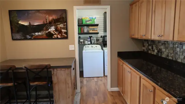 off the kitchen is the laundry area and plenty of room