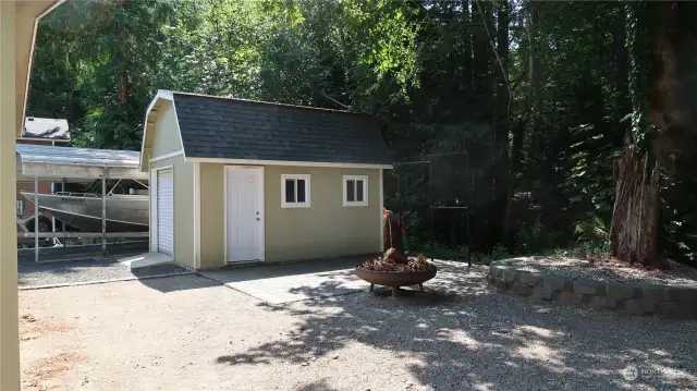 Large size shed for a workshop, etc. A ramp to maneuver things around in and out of.  Metal cover also to keep these dry.