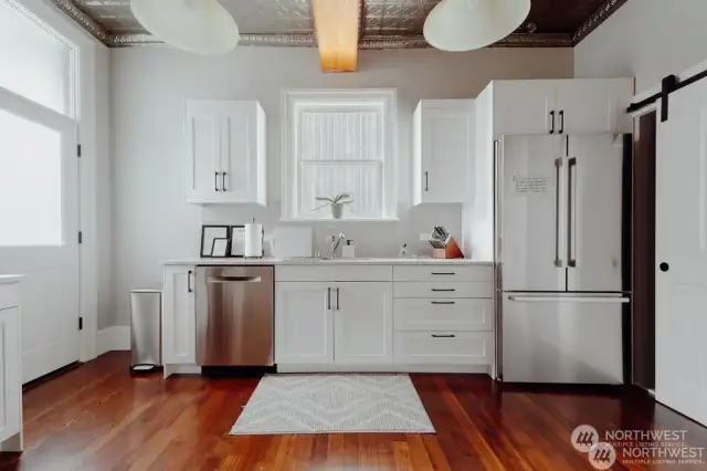 Bright, country kitchen with tin ceiling