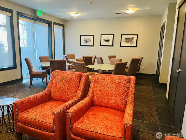 Community Room seating area with access to outdoor table and chairs.