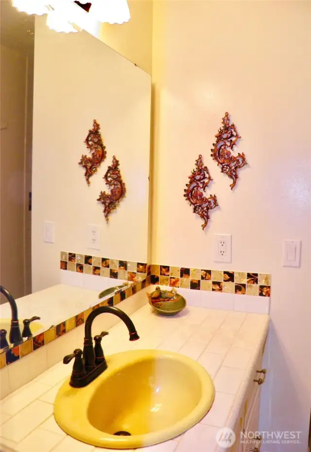 Central bathroom with beautiful tile work.