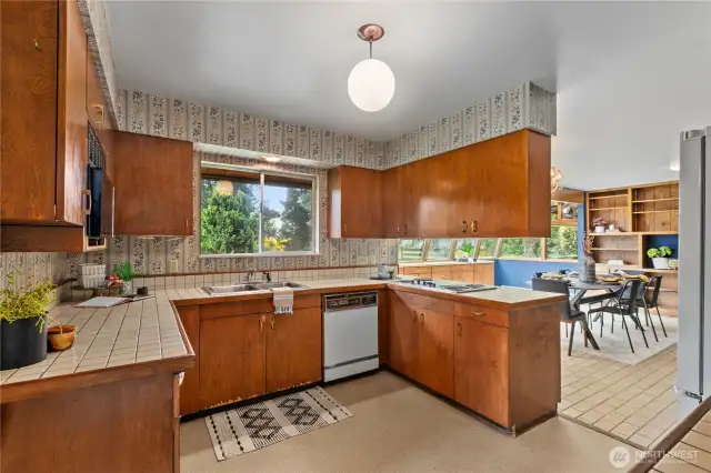 Kitchen shares footprint with solarium and eating area