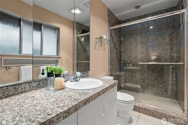 Ensuite shower and vanity finished with granite