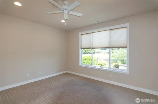 Another view of primary suite.   Notice there are ceiling fans throughout this home.  In addition, there is AC to keep you cool on the hot days.