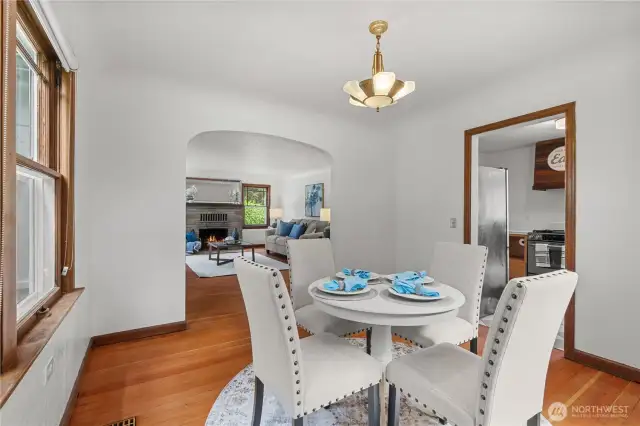 Original touches continue through the dining room with original light fixture and fir floors.