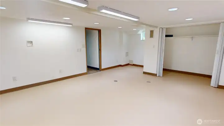 Downstairs family room looking from finished garage