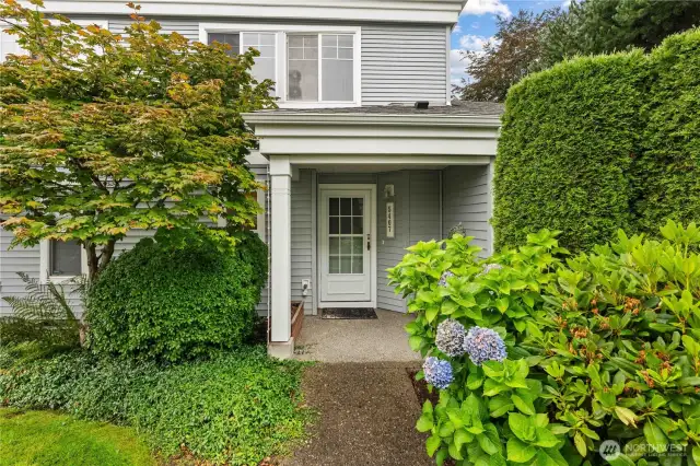 Lovely front entrance with mature landscaping