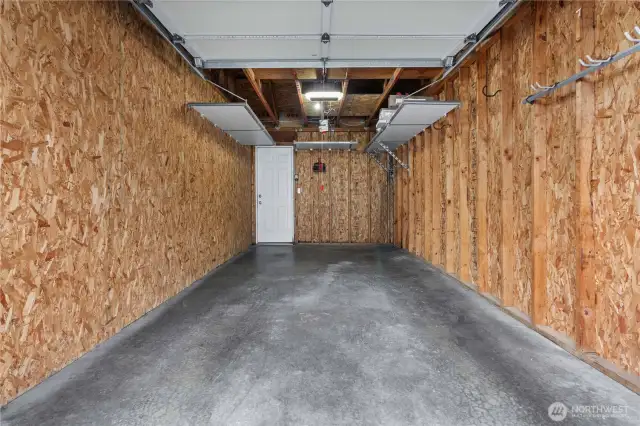 Talk about your immaculate garage with custom overhead storage.  Room for your vehicle and more.  Very secure!  Just down a walk way from your townhome