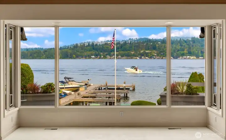 Main level living spaces have commending views of all the water activities at the comfort of your own cozy living room.