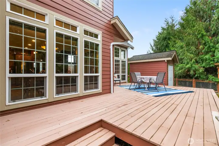 Beautifully maintained large deck with two levels offering separate spaces for your deck decor.
