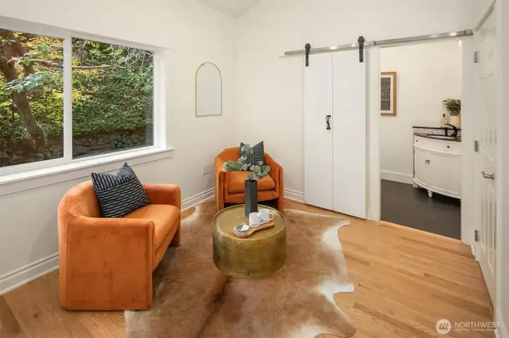 Primary on main floor with view into bathroom.