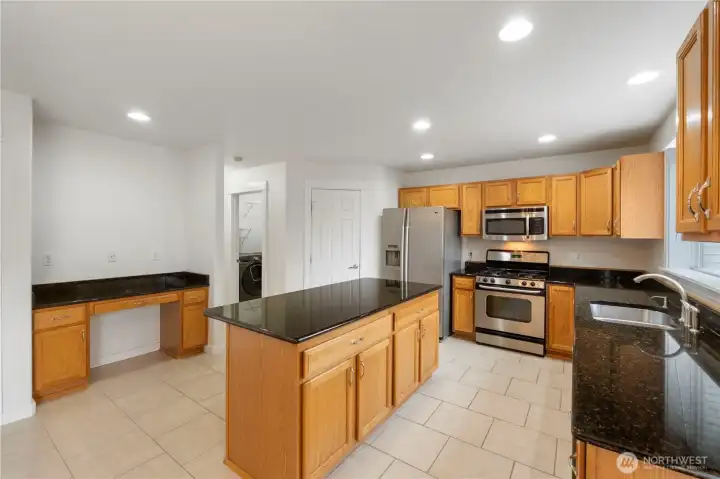 Granite countertops throughout kitchen.