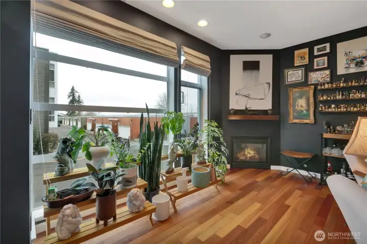Light-filled living room with dramatic floor-to-ceiling window.
