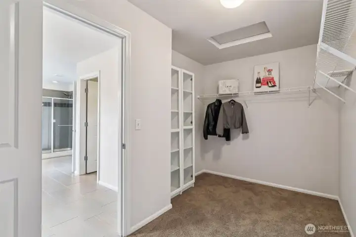 Primary bedroom walk-in closet