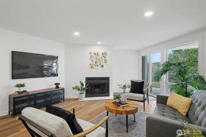 Living area with fireplace and deck access