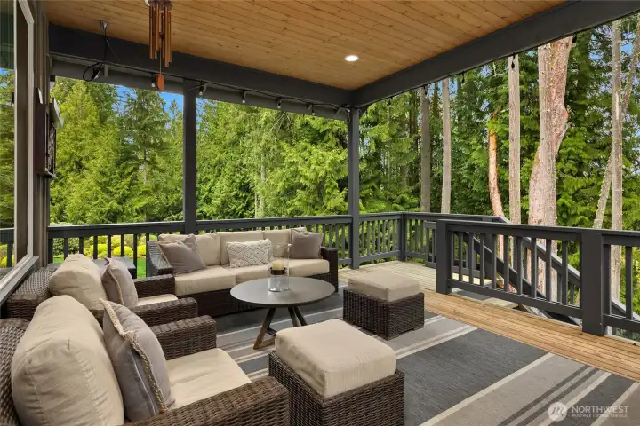 Out from the kitchen to this fabulous covered deck. Perfect for entertaining, year round gatherings and a quiet space for a zoom call!