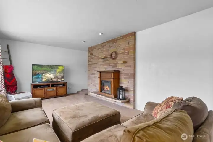 Living room with an inviting fireplace that creates a warm and welcoming focal point.
