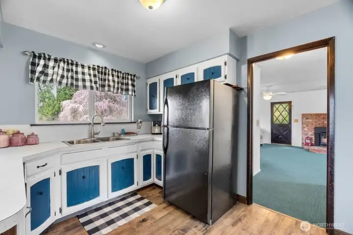 Window above the sink frames the outdoor view.