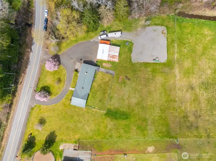 Aerial view showcasing level, usable acreage.