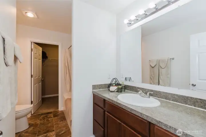 Primary bathroom into walk-in closet