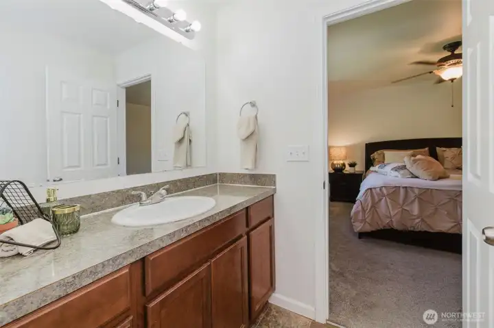 Primary bathroom looking into bedroom
