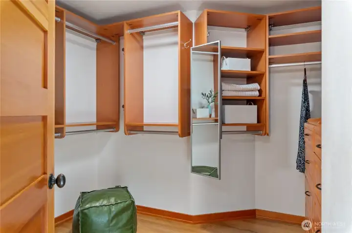 One of two closets in the primary - full outfitted with California closet systems.
