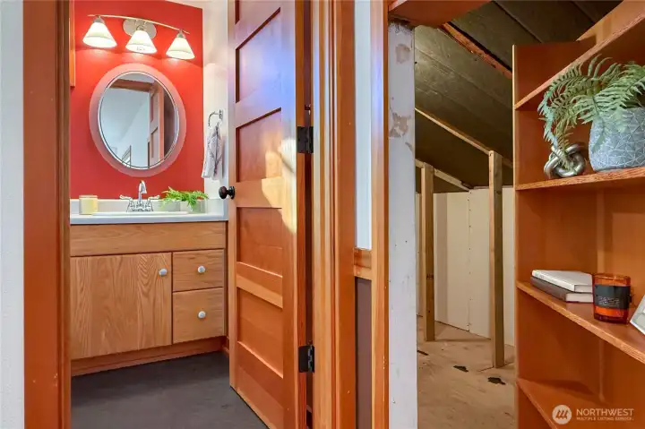 Secret access to attic storage behind the bookcase.