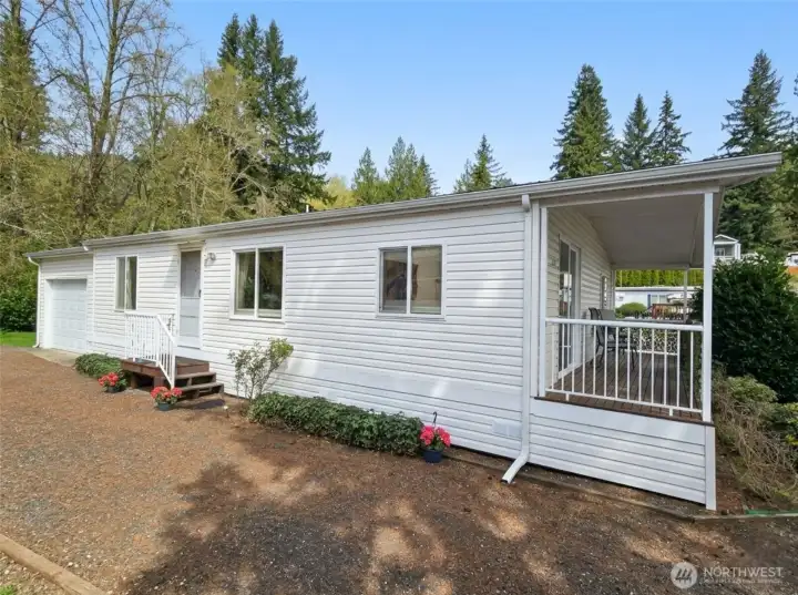 Inviting exterior with low-maintenance  landscaping and welcoming entryway