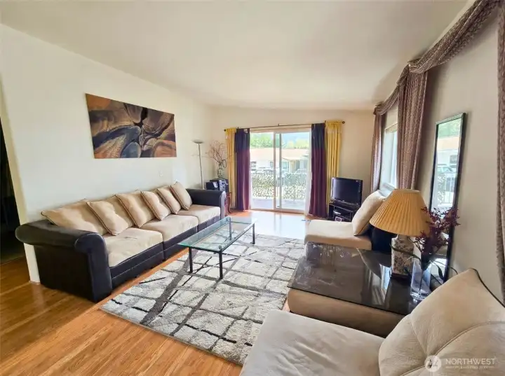 Light-filled living room with open layout and  easy flow to kitchen and outdoor areas