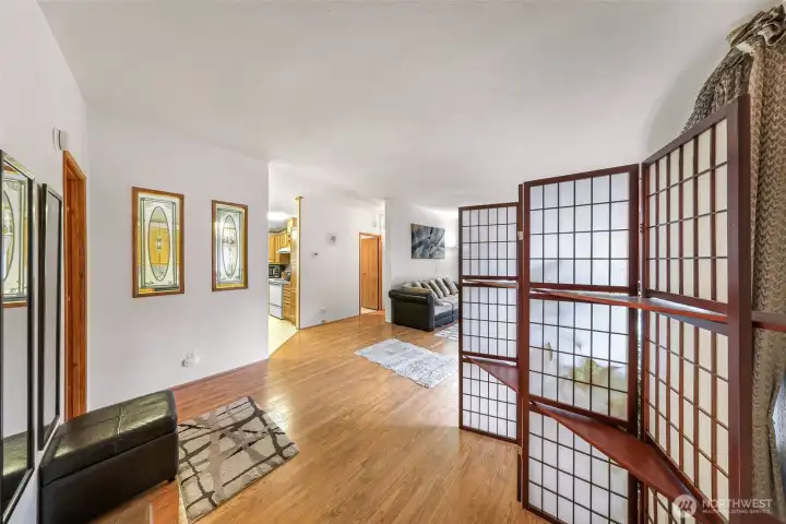 Open-concept entry connecting seamlessly to  the main living and kitchen spaces