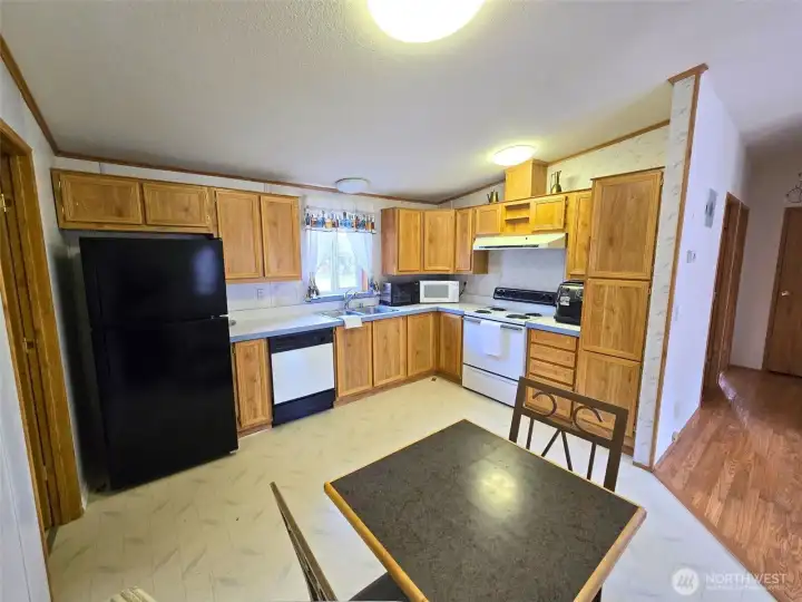 Kitchen and dining area positioned for  efficient use within the open floor plan