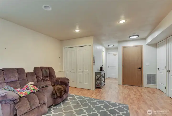 Rec room with extra large bedroom and one normal size bedroom