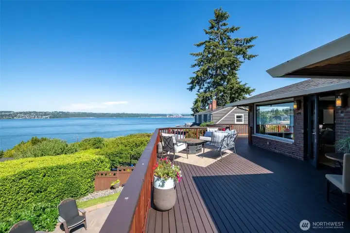 Wake up to Commencement Bay views so expansive, you'll feel the water is your own. Watch Wednesday evening sailboat regattas, marvel at yachts, cargo ships, and sea planes, thrill at the December Christmas Boat Parade, and catch the occasional Orca surfacing while Bald Eagles soar overhead. The Fourth of July fireworks? Front-row seats. Straight north, Browns Point Lighthouse anchors a sweeping panorama that takes in Vashon Island, the Cascade foothills, and from the deck and upper southeast bedroom with a stunning Mt. Rainier view to the northeast. This is Tacoma's ultimate view property.The chef's kitchen is equally extraordinary, anchored by a Sub-Zero refrigerator, Miele espresso machine, Gaggenau oven, and steam oven. It opens to an enormous deck purpose-built for entertaining with that breathtaking panorama as your backdrop.This beautiful brick home was remodeled to the studs in 2005, and the current owner has continued investing into the exterior amenities that include; extensiv Wake up to Commencement Bay views so expansive, you'll feel the water is your own. Watch Wednesday evening sailboat regattas, marvel at yachts, cargo ships, and sea planes, thrill at the December Christmas Boat Parade, and catch the occasional Orca surfacing while Bald Eagles soar overhead. The Fourth of July fireworks? Front-row seats. Straight north, Browns Point Lighthouse anchors a sweeping panorama that takes in Vashon Island, the Cascade foothills, and from the deck and upper southeast bedroom with a stunning Mt. Rainier view to the northeast. This is Tacoma's ultimate view property.The chef's kitchen is equally extraordinary, anchored by a Sub-Zero refrigerator, Miele espresso machine, Gaggenau oven, and steam oven. It opens to an enormous deck purpose-built for entertaining with that breathtaking panorama as your backdrop.This beautiful brick home was remodeled to the studs in 2005, and the current owner has continued investing into the exterior amenities that include; extensiv