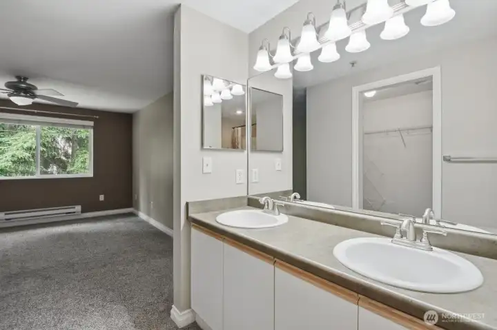 Primary bath vanity looking towards bedroom