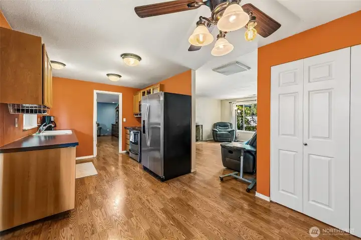 View of dining room and pantry looking into kitchen, living room and doorway into great room