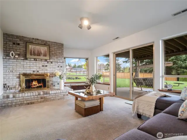 The large brick fireplace in the family room makes you want to curl up with a good book.
