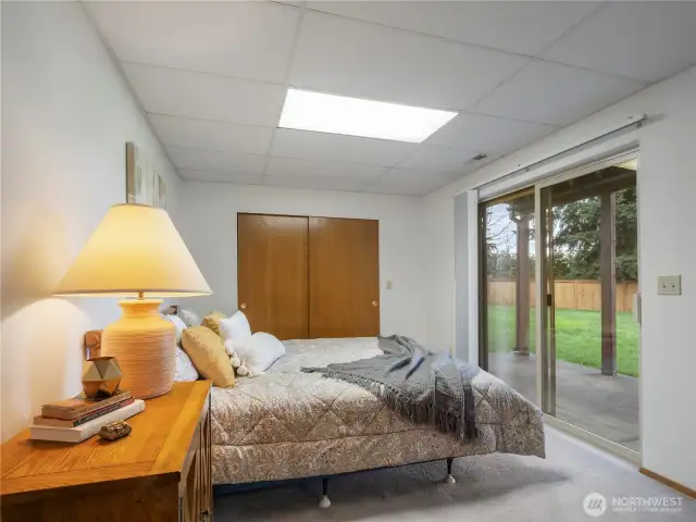 This bedroom has a view of the back yard.