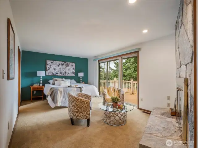 The primary suite located on the main floor is large and even have its own fireplace and room for a sitting area. Walk straight out on the back deck to take in the birdsong while you drink your morning coffee.